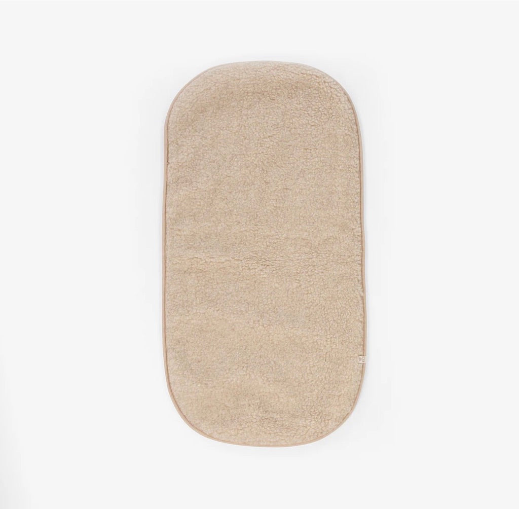 Onderlegger kinderwagen / reiswieg van merinwol - Kico label